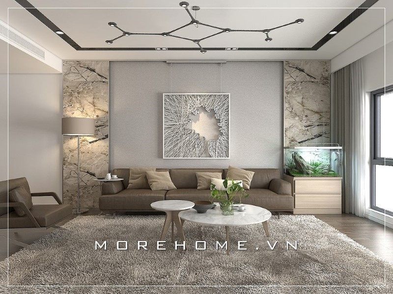 Bàn trà đôi hình tròn mặt đá sáng bóng mang đến sự sang trọng và lịch sự cho không gian phòng khách của gia đình.